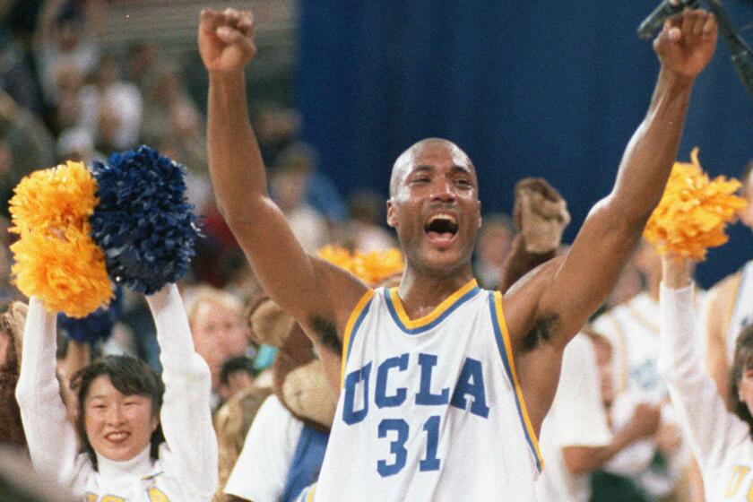 FILE - In this April 3, 1995 photo, UCLA's Ed O'Bannon celebrates after his team won the championship NCAA game.