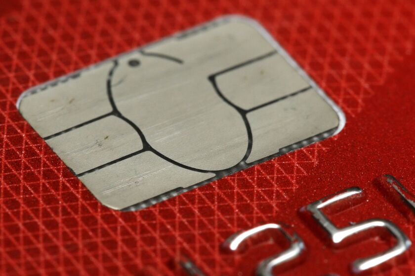 FILE- This June 10, 2015, file photo shows a chip credit card in Philadelphia. Brushing up on the basics of your credit score can give you a fresh start this year and help you know how best to build and defend it. (AP Photo/Matt Rourke, File)