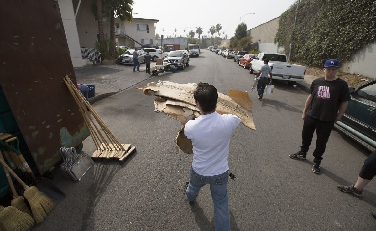 A team of volunteers clean up Kingsley Street in a monthly meet-up organized by the East Hollywood Neighborhood Council.