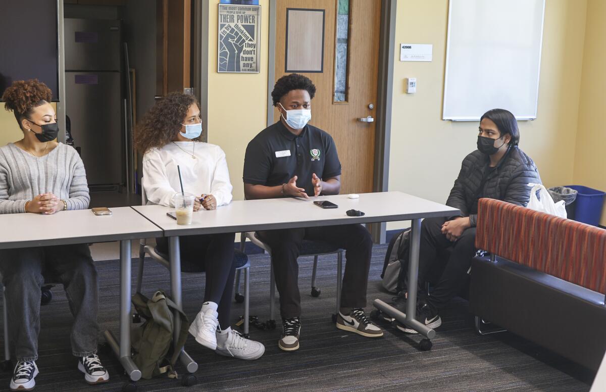 Student Dre Biddle, second from right, speaks with others at the Black Student Center at Cal State San Marcos.