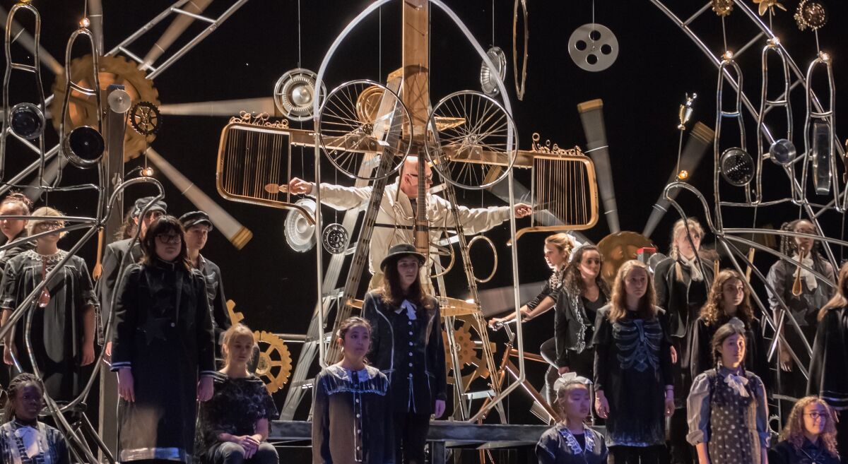 Writer/performer Rinde Eckert, center, and the Brooklyn Youth Chorus perform in the 2016 premiere of "Aging Magician." The production was scheduled to open Friday in San Diego but has been canceled to due to coronavirus concerns.