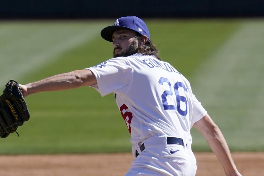 Los Angeles Dodgers pitcher Tony Gonsolin throws a pitch against the Colorado Rockies.