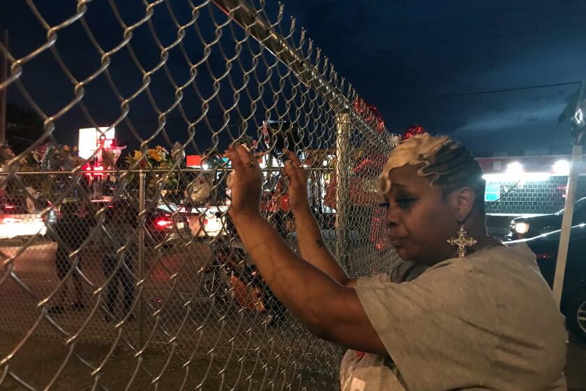 Addie McAtte, 50, stands at the site where her brother, David McAtte, 53, was shot and killed by Louisville police June 1.