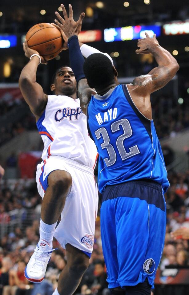 Clippers point guard Chris Paul pulls up for a jumper over Mavericks guard O.J. Mayo on Wednesday night.