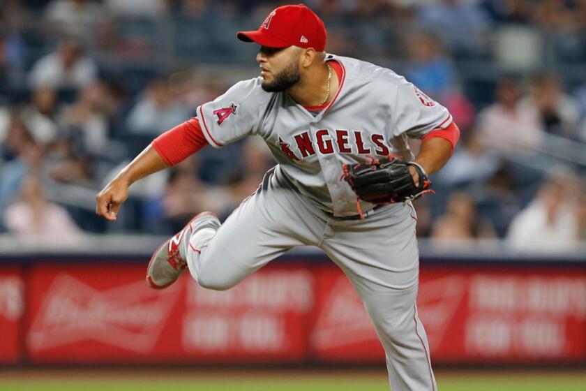 Los Angeles Angels relief pitcher Yusmeiro Petit (36) follows through on a pitch in a baseball game against the New York Yankees Yusmeiro Petit in New York, Thursday, June 22, 2017. (AP Photo/Kathy Willens)