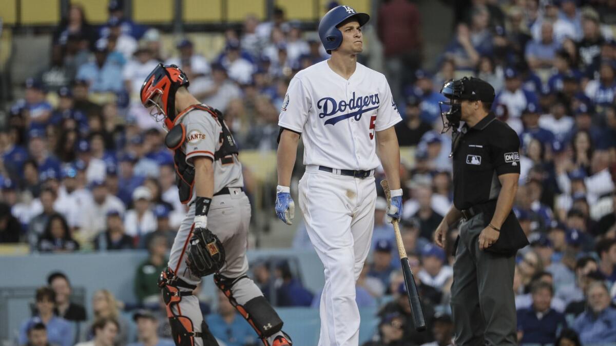 Dodgers shortstop Corey Seager appears frustrated after striking out against Giants pitcher Tony Watson in the eighth inning at Dodger Stadium.