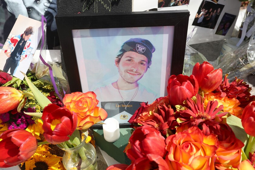 A memorial shrine on the West Coast Highway in Newport Beach honors May 12 crash victims, including artist Andy Chaves.