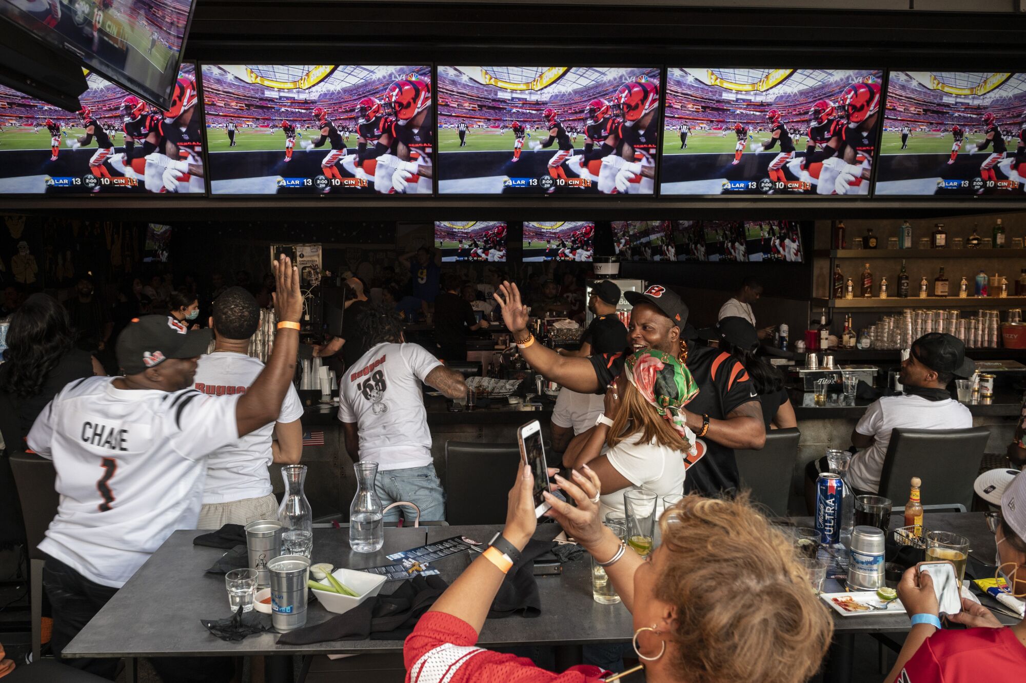 Cincinnati fans watch the Super Bowl at Tom's Watch Bar at L.A. Live in Downtown Los Angeles.
