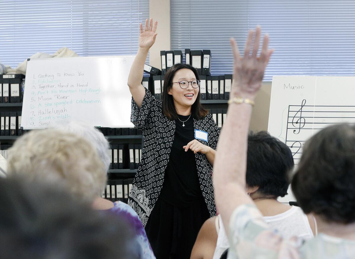 Verdugo Hills Women's Chorus director Ki Park led last year's annual summer rehearsal at the La Crescenta Presbyterian Church. It's an opportunity for chorus members to get together during their off-season, as well as an open call for prospective members .