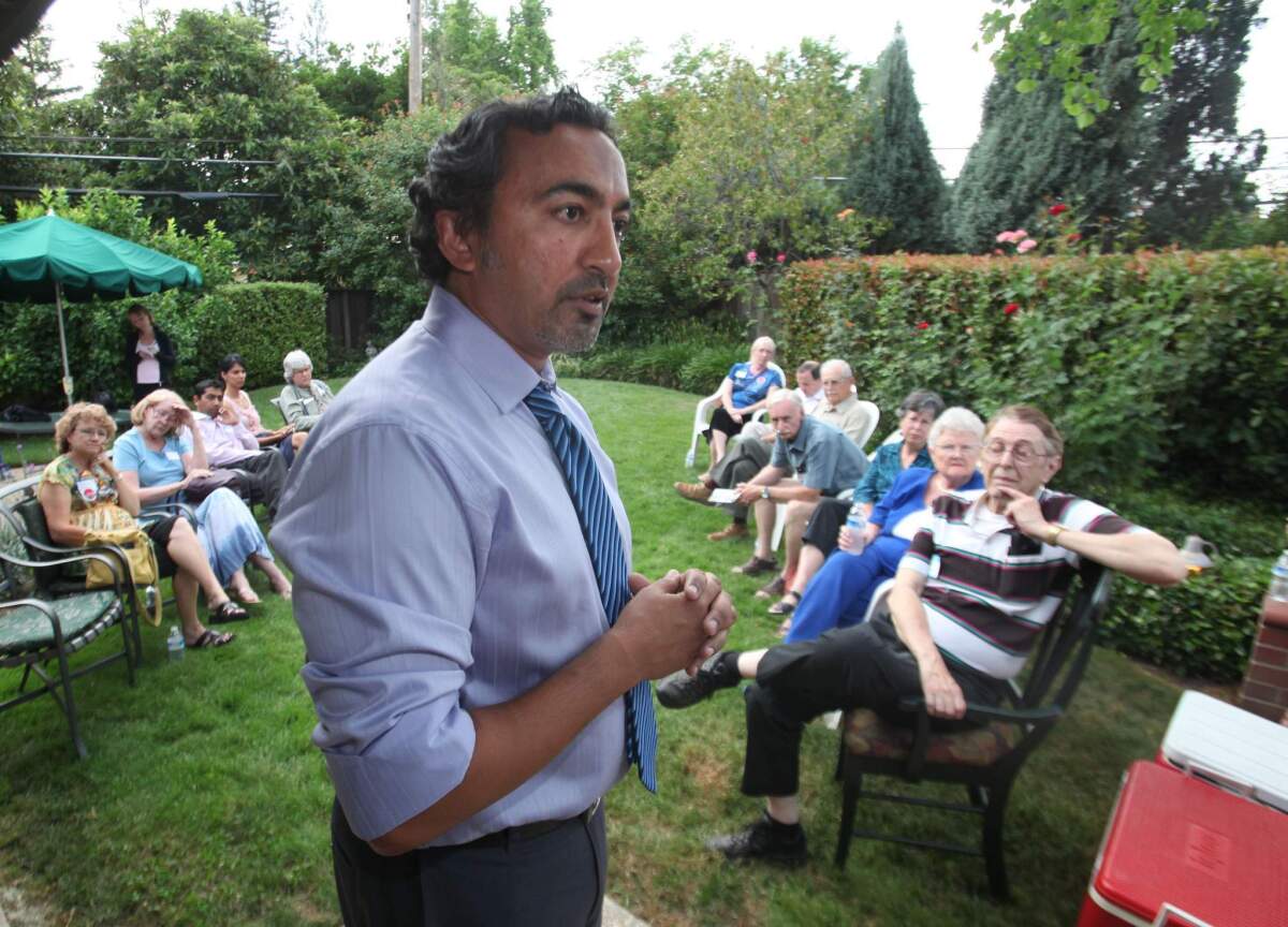 In this 2010 photo, Rep. Ami Bera (D-Elk Grove) addresses supporters at a campaign gathering in Carmichael, Calif. Bera's father has pleaded guility to illegal campaign contributions in 2009 and 2011.