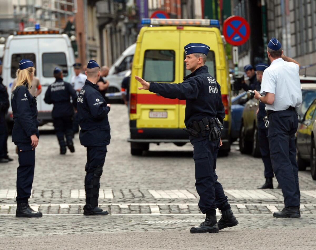 Police officers cordon off the area of shooting near the Jewish Museum in Brussels on May 24, 2014.
