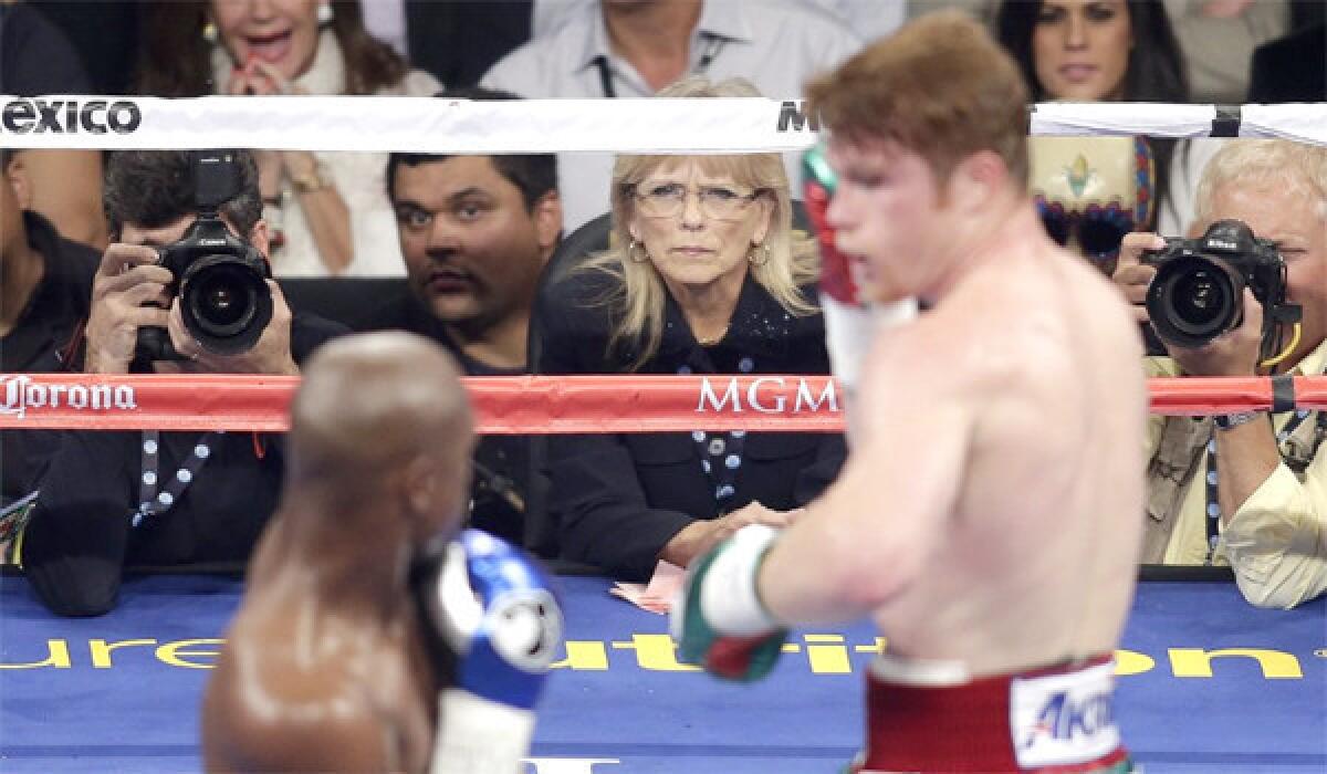 Cynthia Ross, center, who was one of three judges scoring the Floyd Mayweather Jr.-Saul 'Canelo' Alvarez fight, has decided to step away from boxing after taking harsh criticism for scoring the fight a draw.
