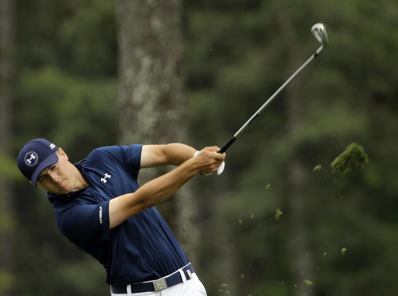 Jordan Spieth hits off the first fairway during the fourth round.