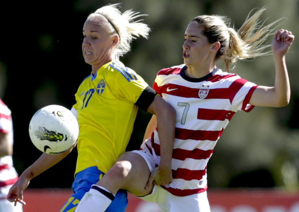 Sweden midfielder Caroline Seger (17) vies for the ball against U.S. midfielder Morgan Brian (7) during their Algarve Cup game on Friday in Albufeira, Portugal.