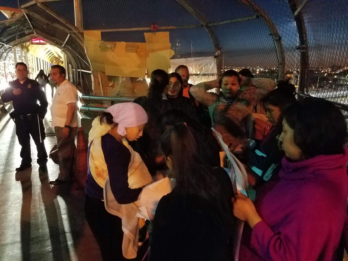 Raquela Pedro Juan, 21, of Guatemala, who gave birth to daughter Ana Sofia Pedro Juan on May 9, 2019, attempts to cross the border bridge to El Paso. At right is Enma Hernandez, 26, who is eight months pregnant.