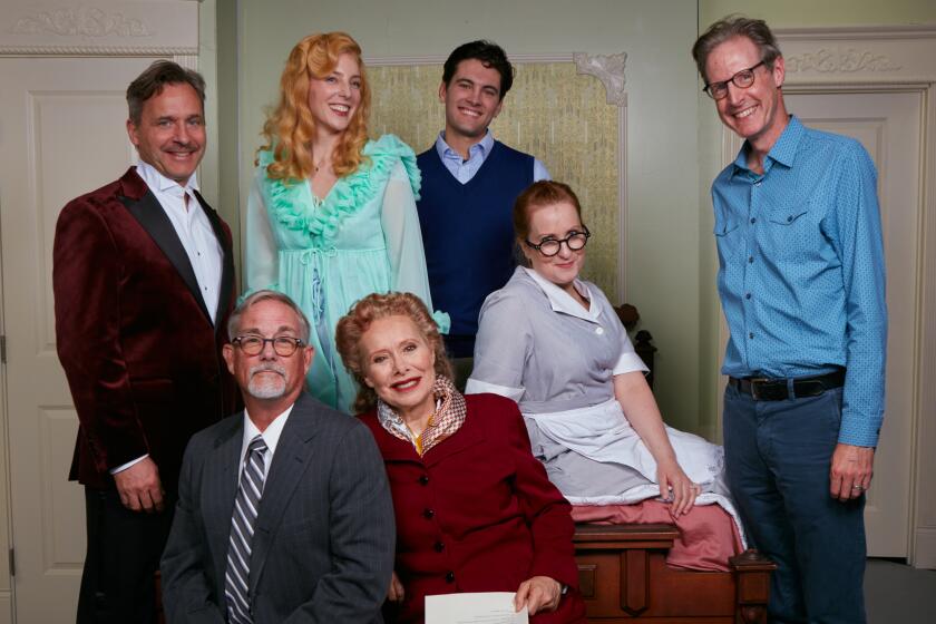 Playwright Paul Slade Smith, right, with the cast of  "The Angel Next Door."