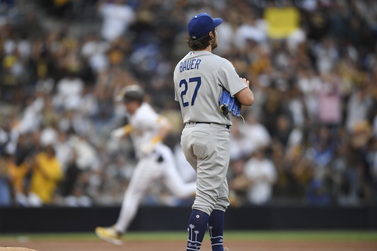 Dodgers pitcher Trevor Bauer stands on the mound after giving up a home run to Padres' Jake Cronenworth on June 23.