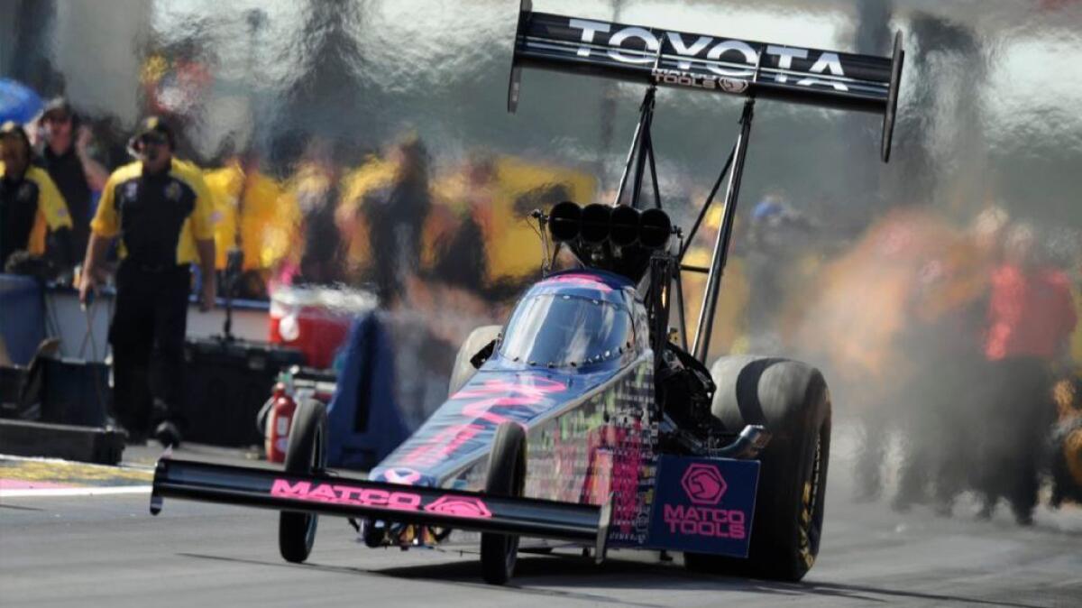 Antron Brown powers his Matco Tools dragster during the top-fuel competition at the Texas NHRA FallNationals on Oct. 16.