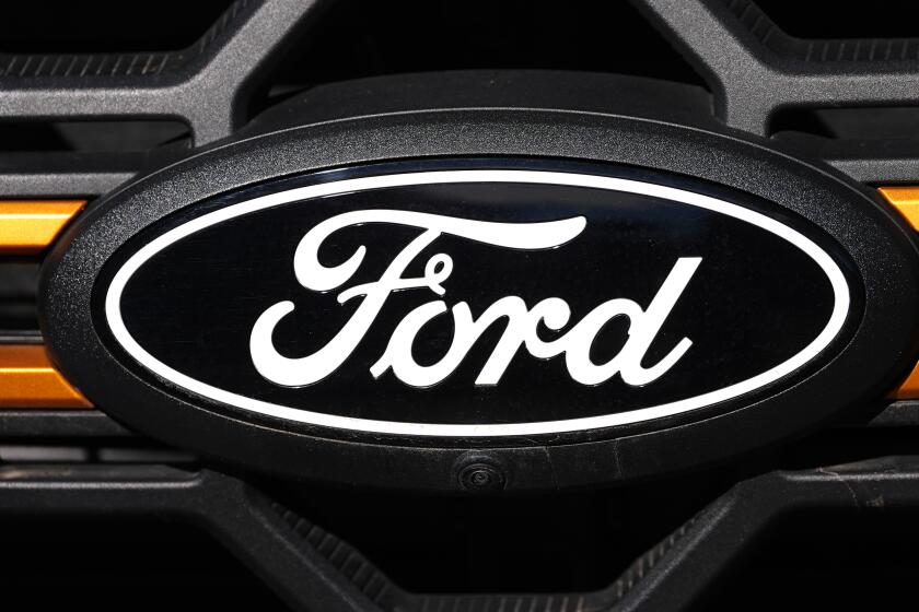 FILE - The company logo is shown on the grille of an unsold 2026 F-series pickup truck on the lot of a Ford dealership Sunday, Nov. 2, 2025, in Littleton, Colo. (AP Photo/David Zalubowski, file)