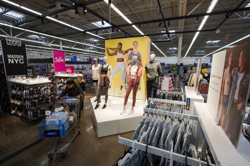 Customers walk around the Walmart Supercenter, Thursday, Feb. 9, 2023, in North Bergen, N.J. On Friday, the Commerce Department issues its January report on consumer spending. (AP Photo/Eduardo Munoz Alvarez)