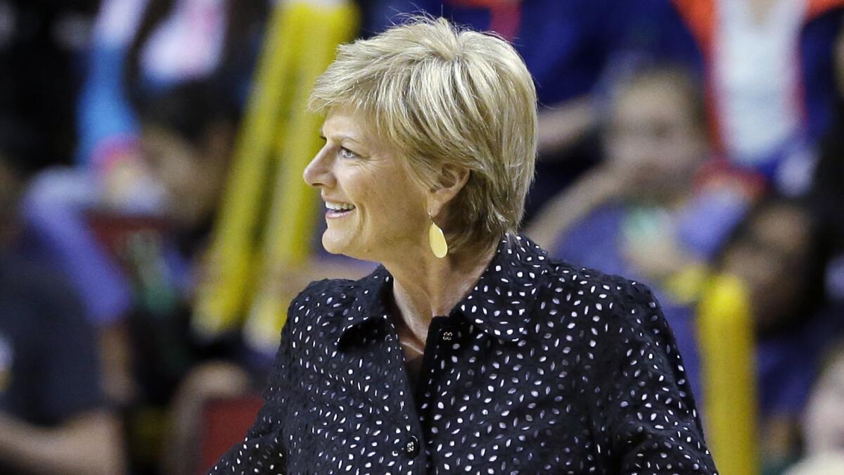 Sparks Coach Carol Ross smiles during a game against the Seattle Storm on Tuesday.