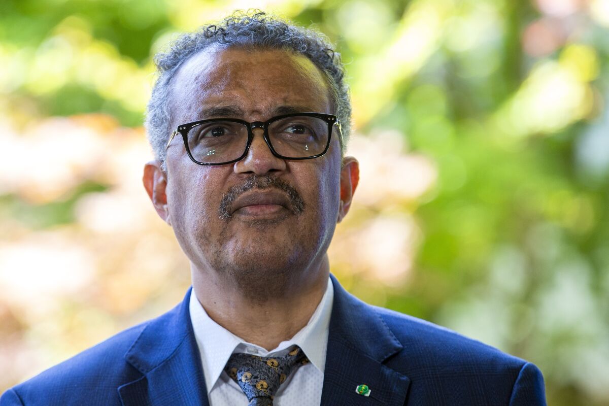 FILE - In this June 25, 2020, file photo, Tedros Adhanom Ghebreyesus, director general of the World Health Organization (WHO), attends a press conference, at its headquarters in Geneva, Switzerland. Tedros says he will self-quarantine after being identified as a contact of a person who tested positive for COVID-19. He wrote on Twitter late Sunday, Nov. 1, 2020, that he is “well and without symptoms” but will self-quarantine in “coming days, in line with WHO protocols, and work from home.” (Salvatore Di Nolfi/Keystone via AP, File)
