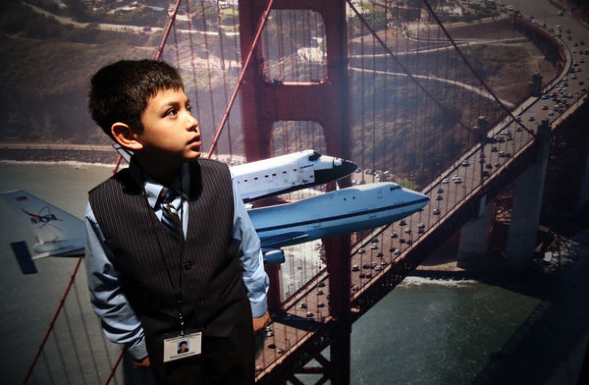 Richard Hercules, a fifth-grader at Century Park Elementary School, visiting an exhibition related to the space shuttle Endeavour at the California Science Center.