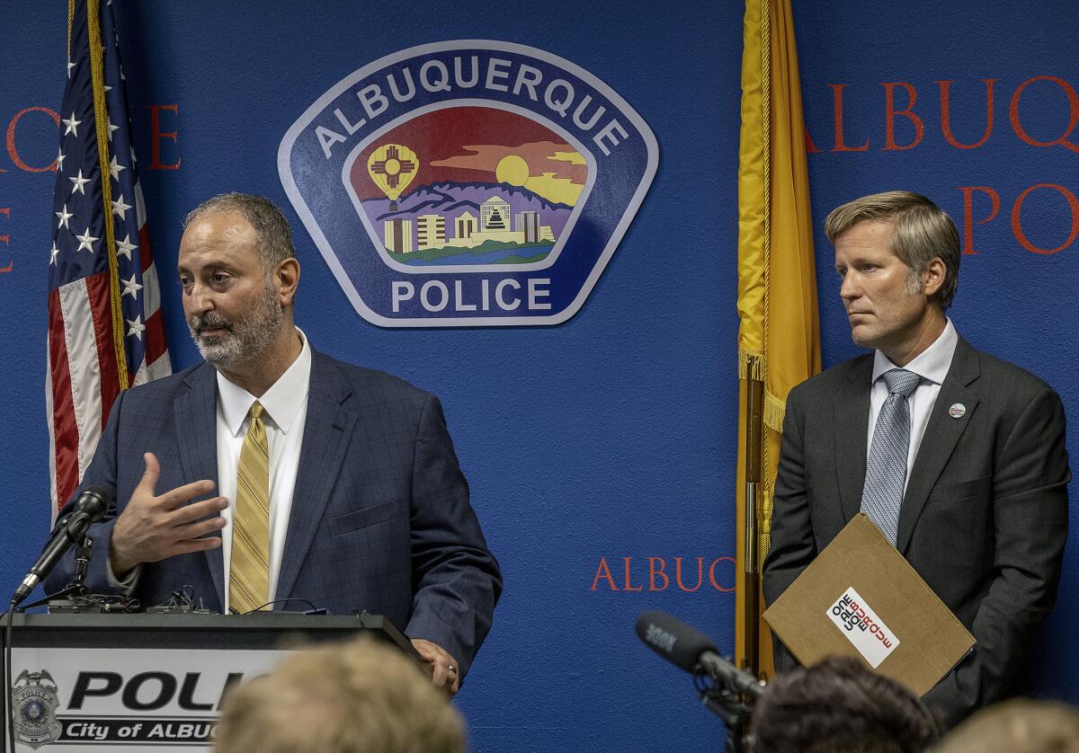Two men at a news conference in Albuquerque