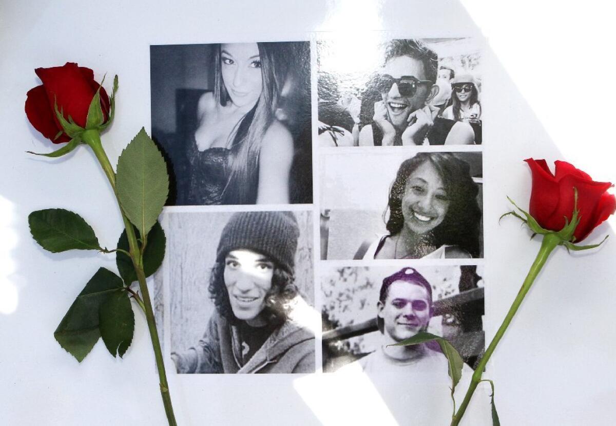 A collage with photos of car crash victims, clockwise, from top left, Sugey Cuevas, Sameer Nevarez, Malak Hariri, Stephen Stoll and Sebastian Forero was placed at a memorial set up on San Fernando Road where it crosses under Golden State (5) Freeway on Monday, where the fatal incident occurred.