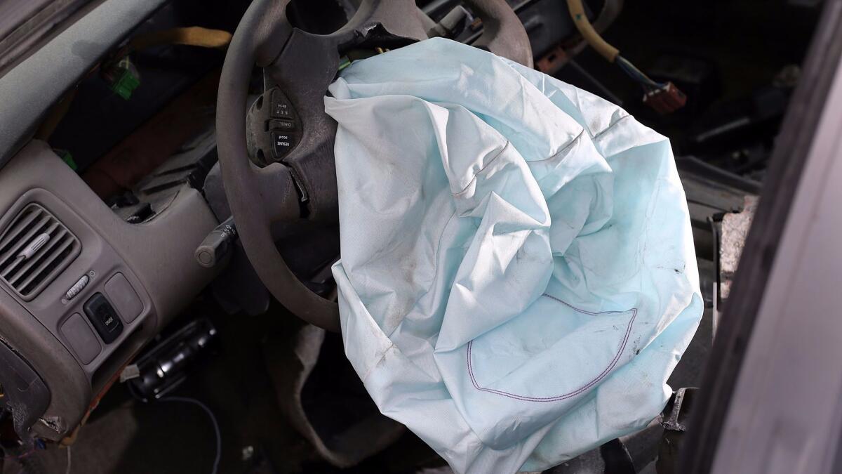 An airbag is deployed in a Honda Accord.