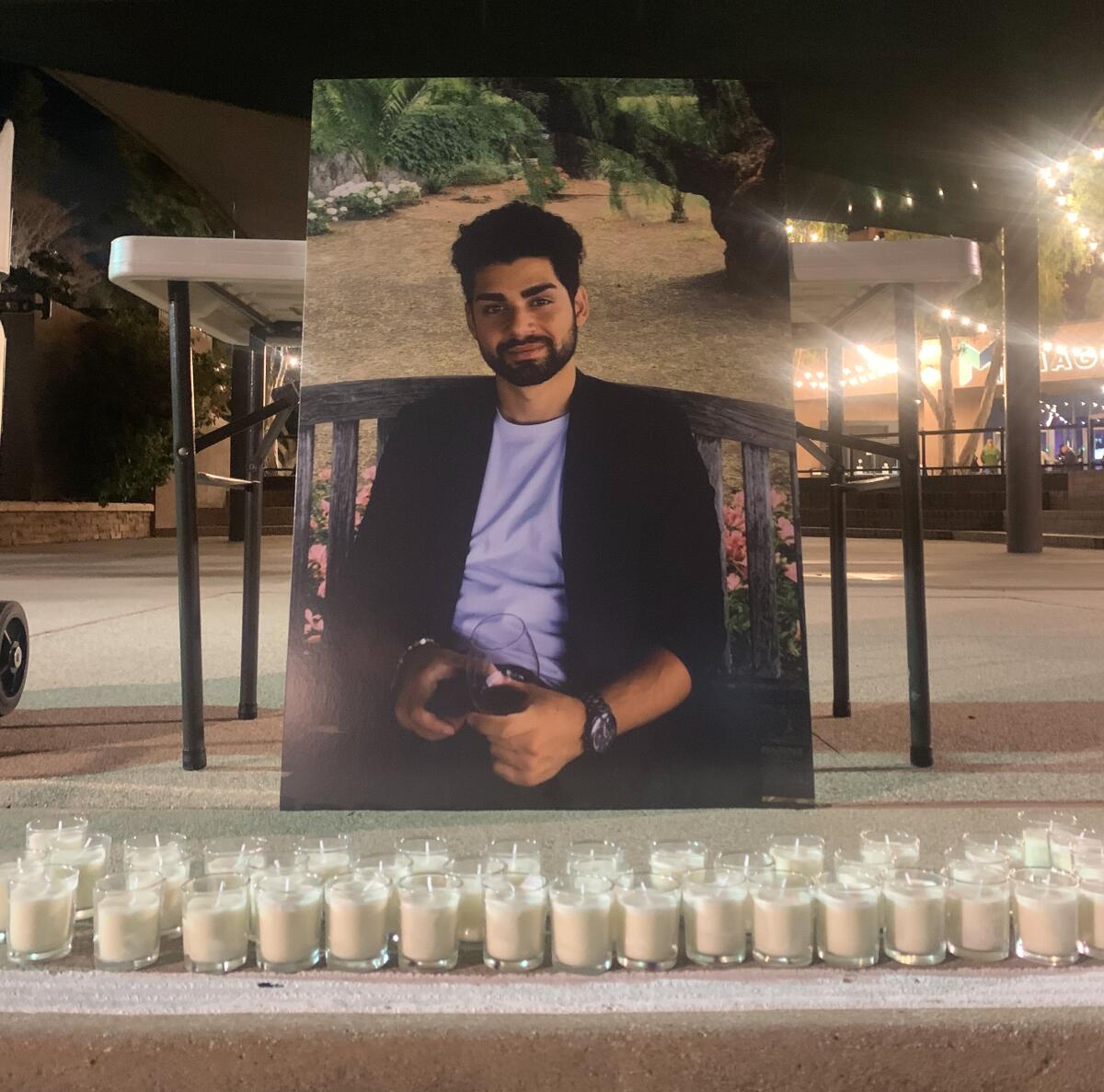Pportrait of Benjamin Harouni displayed at a candlelight vigil in front of El Cajon City Hall March 3.