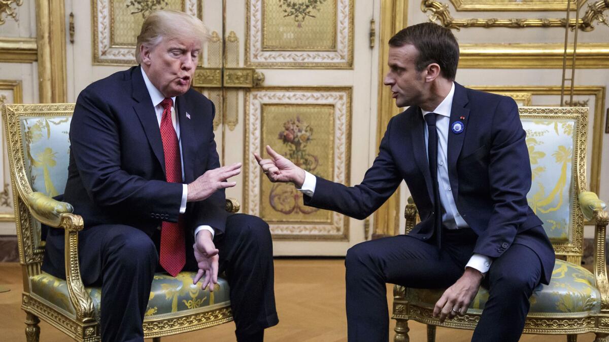 President Trump and French President Emmanuel Macron meet at the Elysée Palace in Paris.
