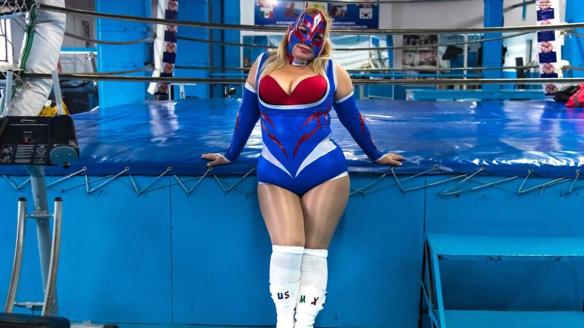 Cristal, a professional wrestler in Mexico City, is one of many women in typically male fields photographed by Agence France-Presse to mark International Women's Day.