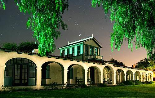 Rancho Guajome is illuminated under a starry sky. Author Helen Hunt Jackson spent several days at the San Diegoic> County hacienda, which bears a likeness to the one in her popular novel, Ramona.