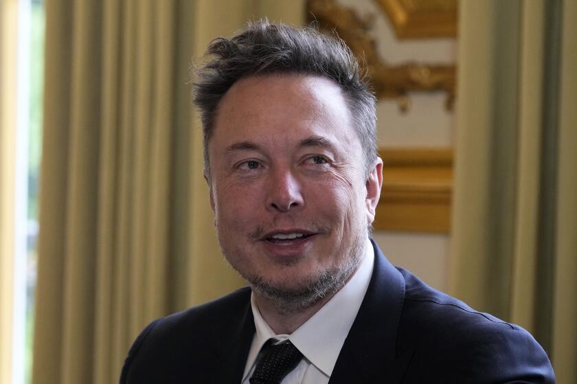FILE - Twitter, now X. Corp., and Tesla CEO Elon Musk poses before his talks with French President Emmanuel Macron, May 15, 2023, at the Elysee Palace in Paris. A California man who says he was harassed after Musk amplified posts on his platform X, formerly known as Twitter, that falsely placed the man at a confrontation involving far-right protesters sued the billionaire for defamation in a lawsuit filed Monday, Oct. 2. (AP Photo/Michel Euler, Pool, File)