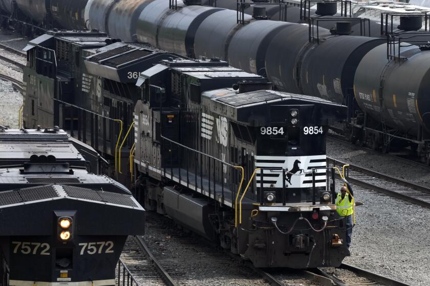 FILE - Norfolk Southern locomotives are moved through the Conway Terminal in Conway, Pa., June 17, 2023. The activist investors trying to take control of Norfolk Southern's board are picking up key support, but the railroad's CEO promised Monday, April 29, 2024, to continue fighting until the May 9 vote because he believes his strategy is the best in the long run for investors, customers and workers. (AP Photo/Gene J. Puskar, File)