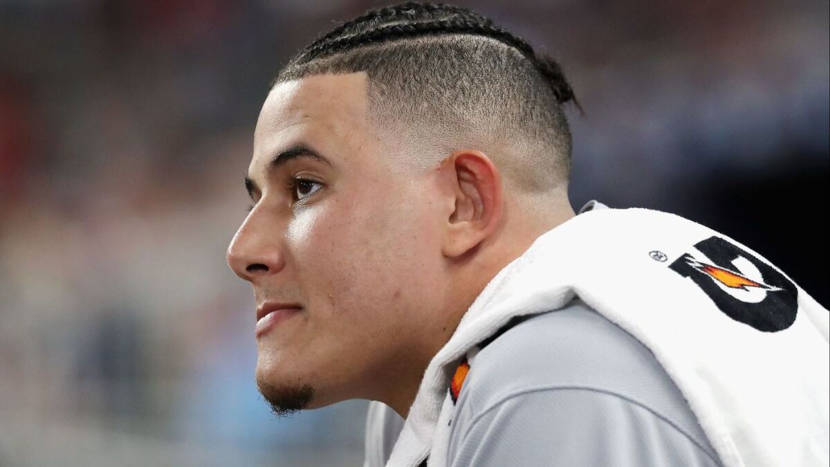Manny Machado looks on in the third inning against the Atlanta Braves during Game 3 of the National League Division Series.