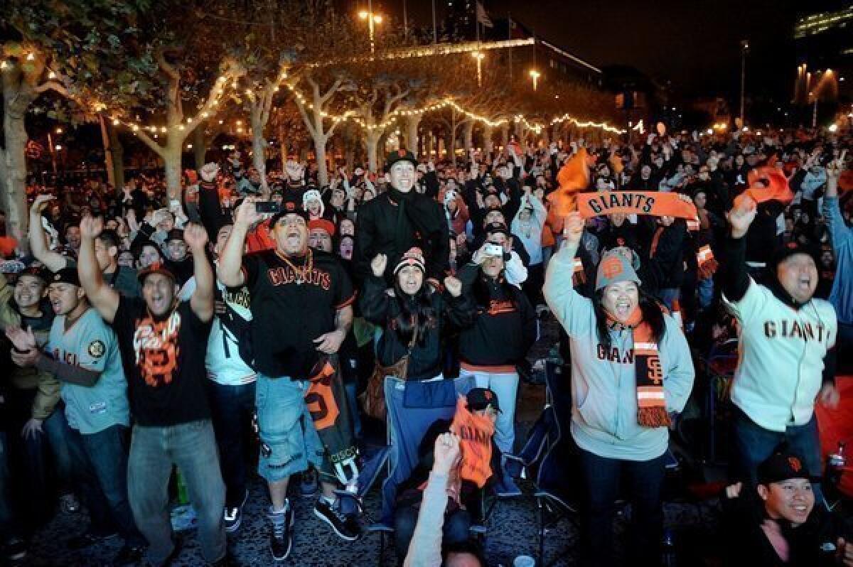 Giants fans celebrate outside San Francisco City Hall.