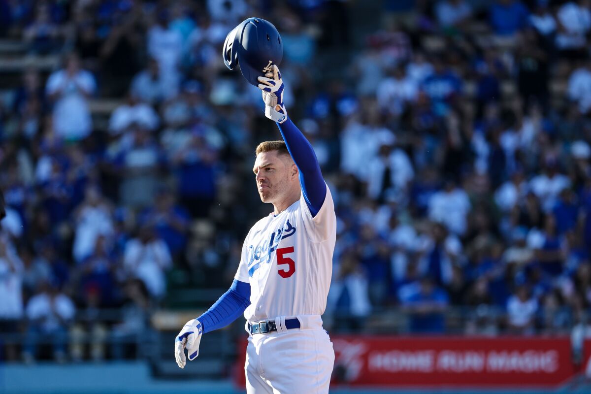 Dodgers' Freddie Freeman acknowledges the crowd on June 25, 2023, in Los Angeles after getting his 2,00th career hit.