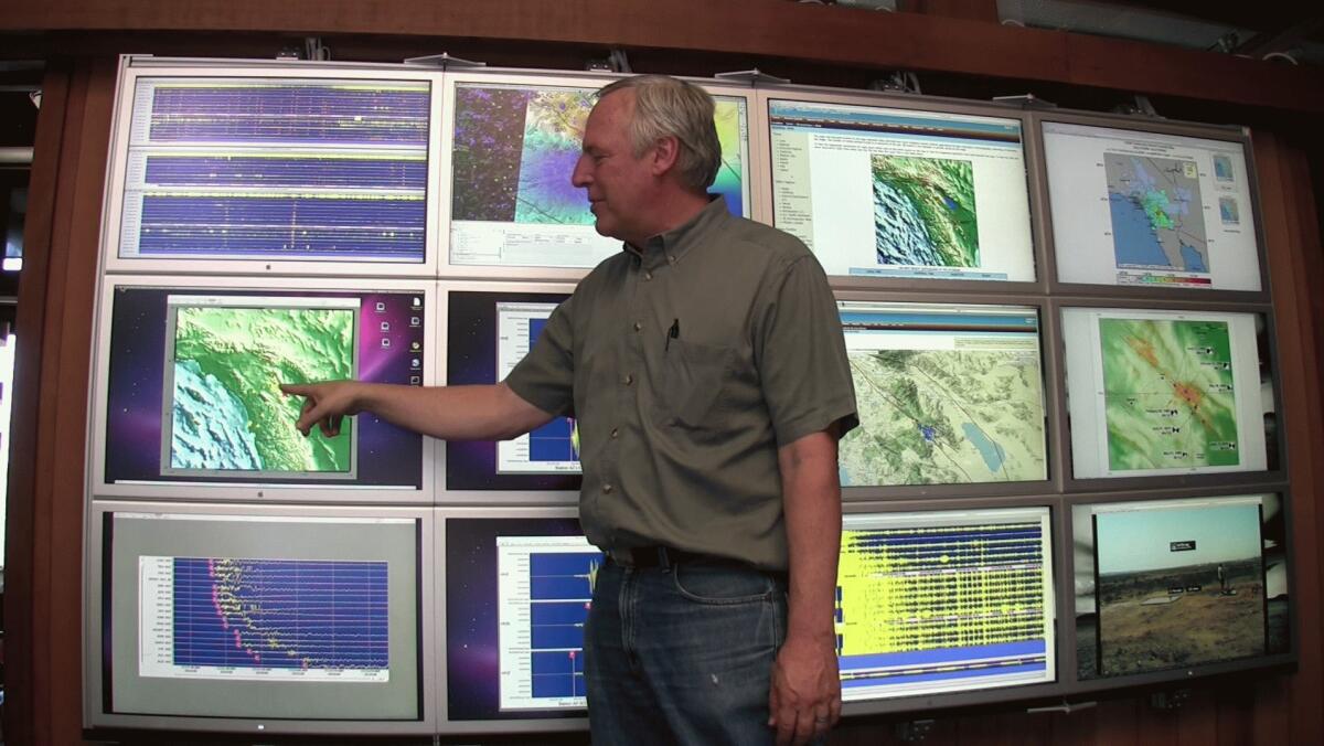 An array of computer monitors allows Frank Vernon, HPWREN project director, to view the images from multiple cameras at once.