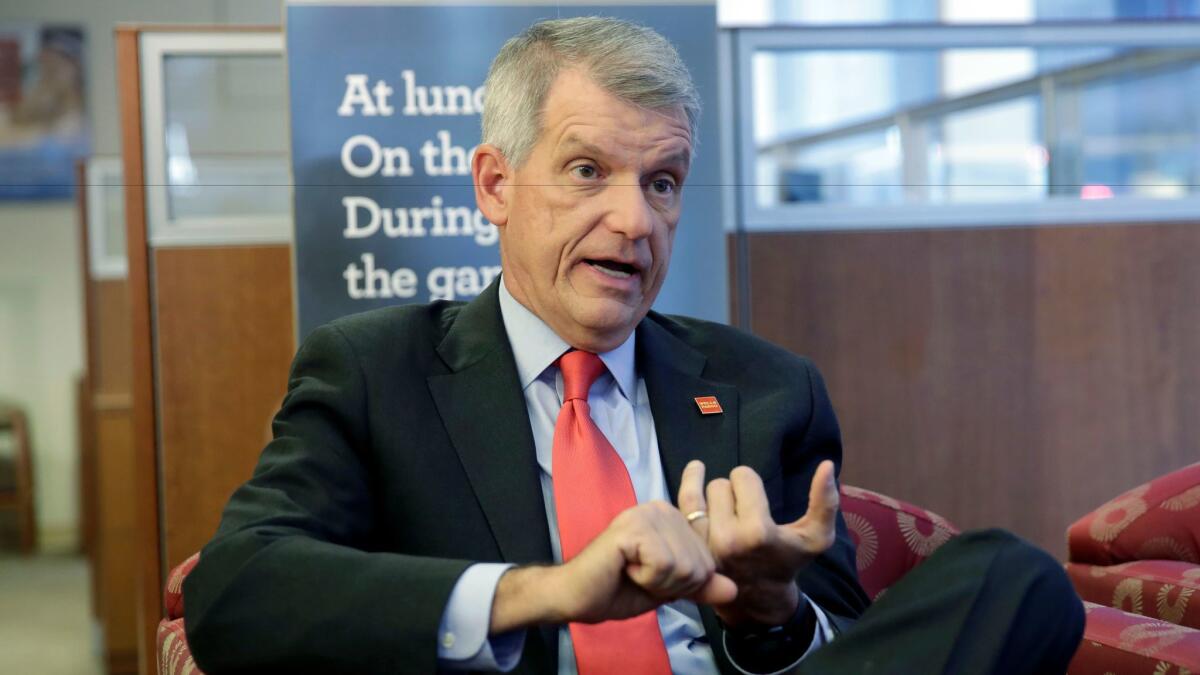 Wells Fargo Chief Executive Timothy Sloan is interviewed in March in a New York bank branch.