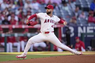 Los Angeles Angels starting pitcher Patrick Sandoval throws to the plate during the first inning.