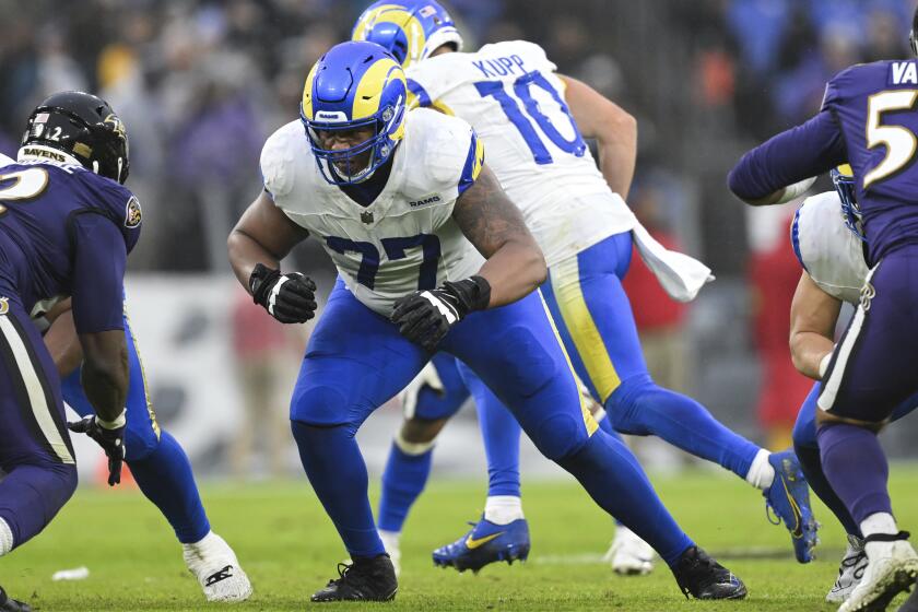 Rams offensive tackle Alaric Jackson (77) blocks against the Baltimore Ravens last season.