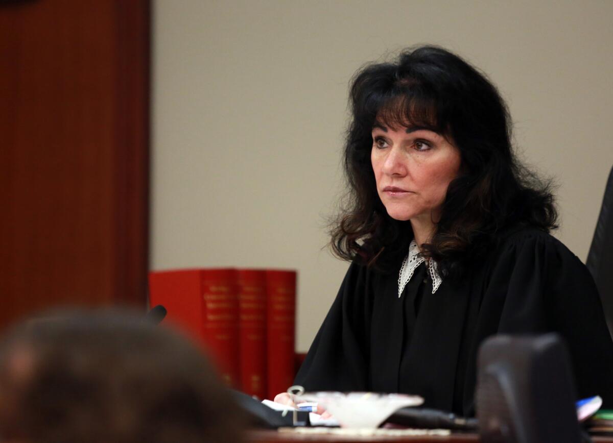 Ingham County Circuit Court Judge Rosemarie Aquilina adjourns a hearing on a lawsuit filed by Detroit pension funds trying to keep city retirees' payments from being cut during bankruptcy proceedings.