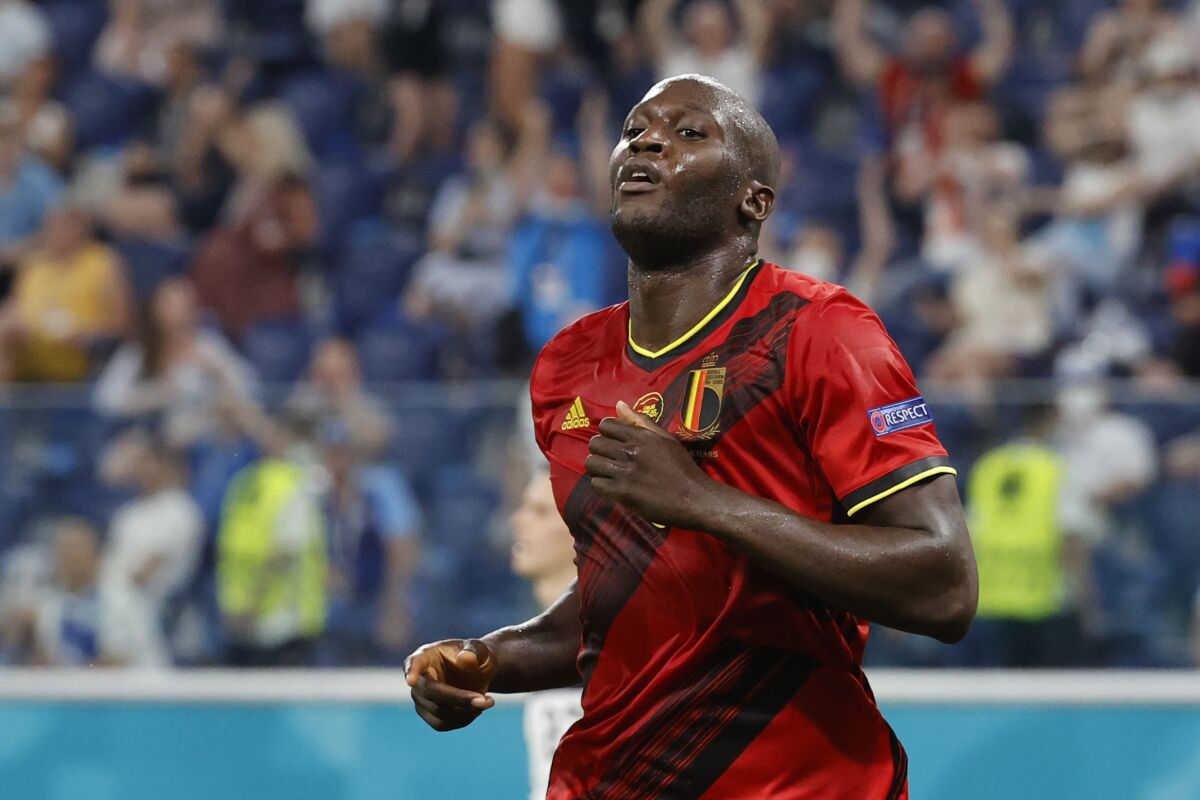 FILE - In this Monday, June 21, 2021 file photo, Belgium's Romelu Lukaku celebrates scoring a goal during theoir Euro 2020 soccer championship match against Finland at Saint Petersburg Stadium in St. Petersburg, Russia. Lukaku won’t need much time to readjust to the Premier League. Less than a week after becoming Chelsea’s most expensive player the 28-year-old Belgium striker pronounced himself ready to play Sunday, Aug. 22 against Arsenal. (Anatoly Maltsev/Pool Photo via AP, file)