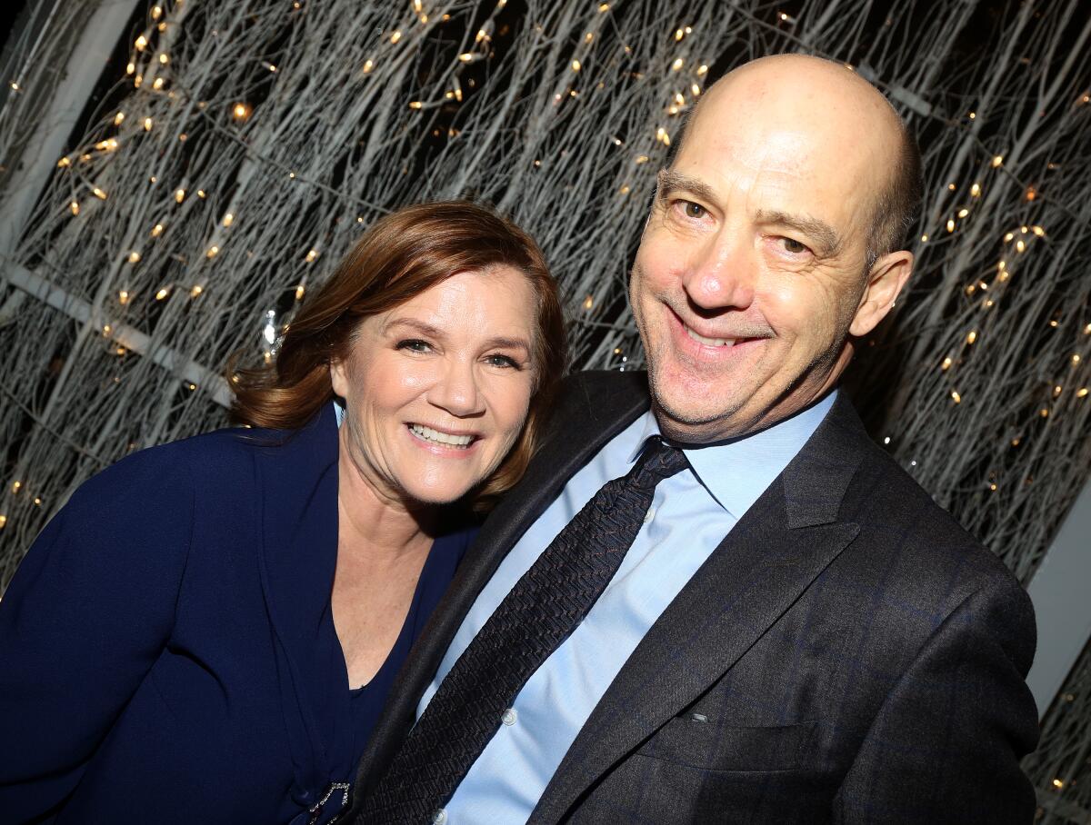 Mare Winningham and Anthony Edwards pose and smile.