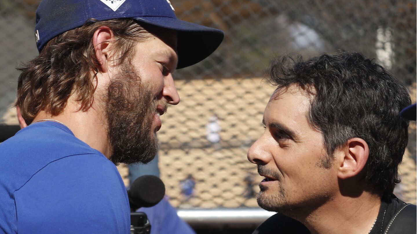 Dodgers ace Clayotn Kershaw meets with country singer Brad Paisley before the start of Game 2.