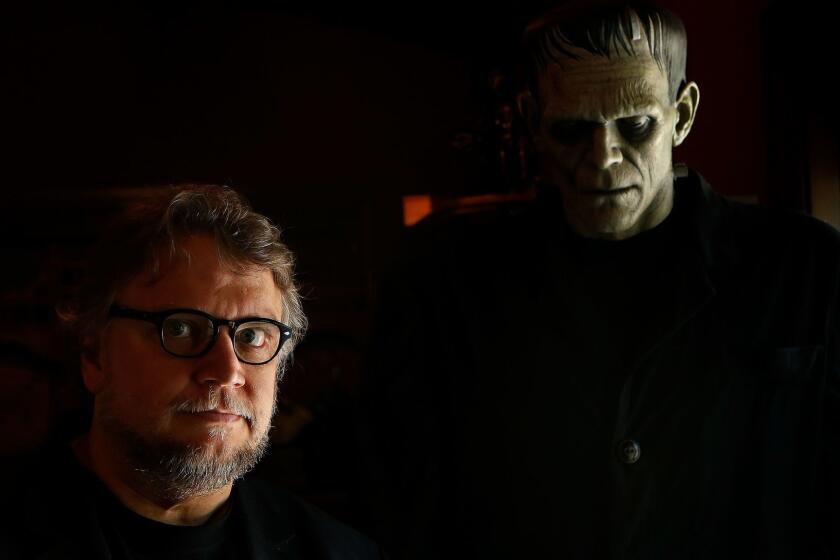 WESTLAKE VILLAGE, JUNE 13, 2016: Director Guillermo del Toro is photographed next to a creature of Frankenstein, on display inside his monster themed Bleak House in Westlake Village on June 13, 2016. The director of fantasy and horror films keeps his collection of books, gory props and mannequins where he can see, and be inspired by them. (Mel Melcon/Los Angeles Times)