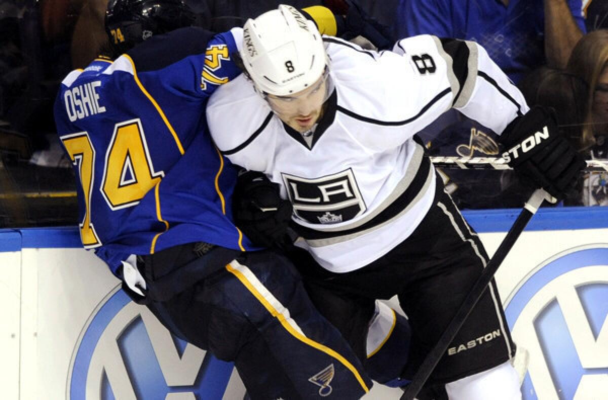 Kings defenseman Drew Doughty collides with Blues winger TJ Oshie in overtime of Game 1 on Tuesday night in St. Louis.