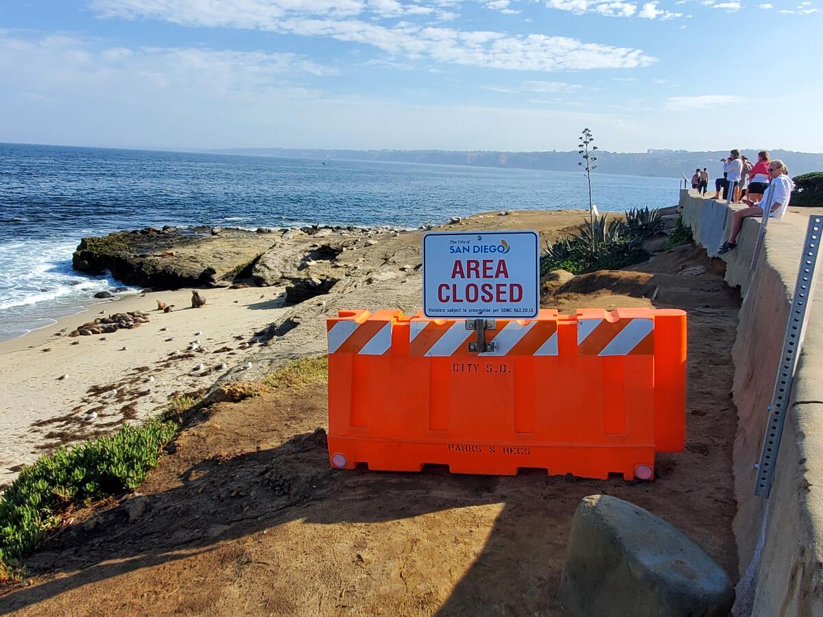 A plastic water-filled barrier marked the edge of the temporary closure of Point La Jolla beginning Aug. 11.